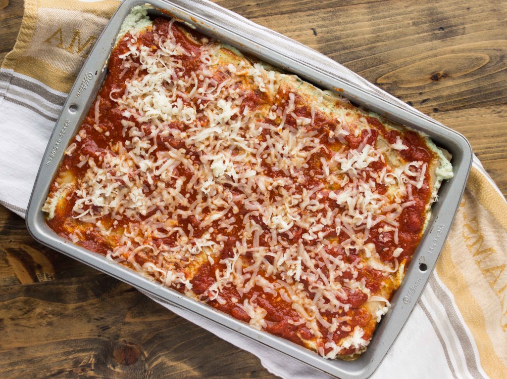 A vegetarian lasagna bursting with flavor from summer squash, basil pesto ricotta, and a homemade tomato sauce | http://veggieandthebeastfeast.com