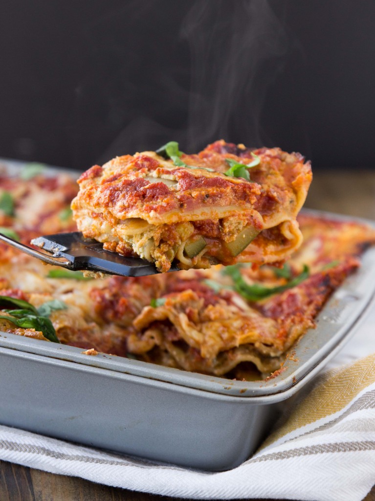 A vegetarian lasagna bursting with flavor from summer squash, basil pesto ricotta, and a homemade tomato sauce | http://veggieandthebeastfeast.com