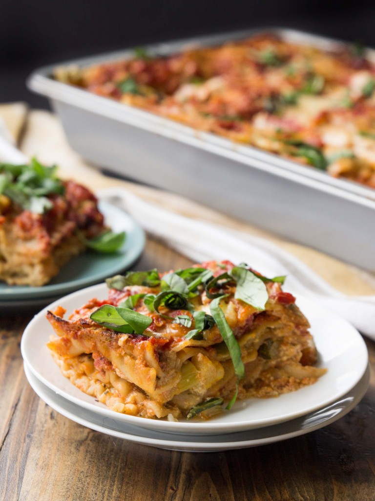A vegetarian lasagna bursting with flavor from summer squash, basil pesto ricotta, and a homemade tomato sauce | http://veggieandthebeastfeast.com