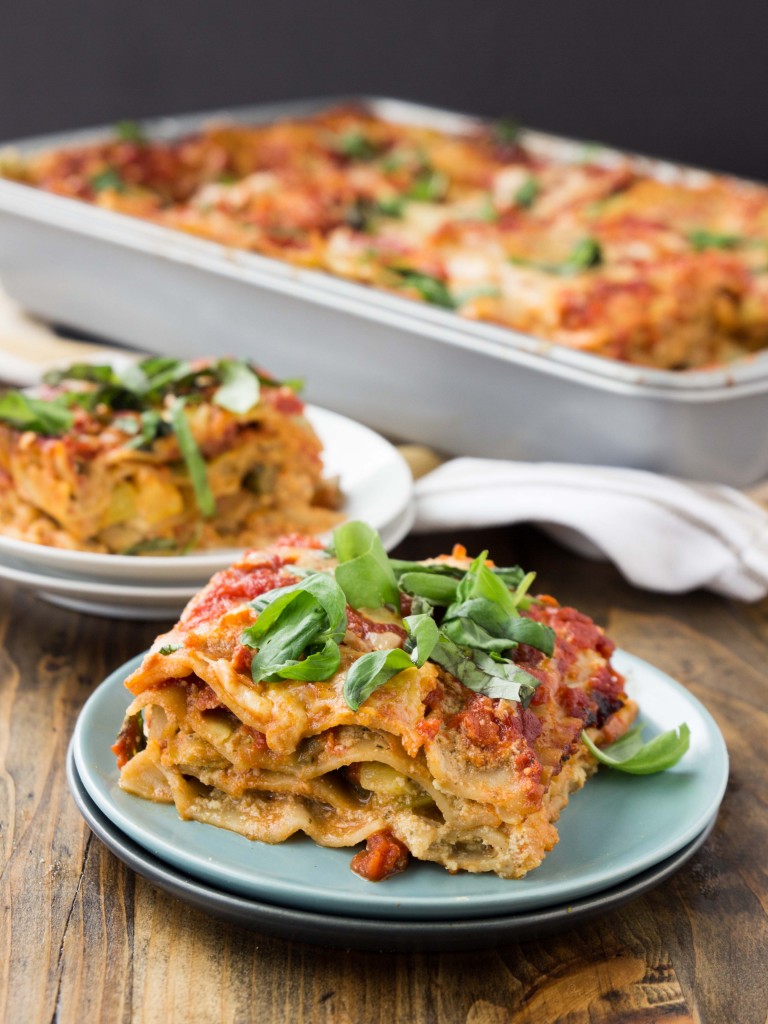 A vegetarian lasagna bursting with flavor from summer squash, basil pesto ricotta, and a homemade tomato sauce | http://veggieandthebeastfeast.com