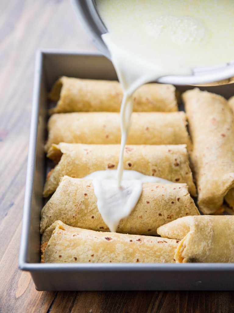 High Protein Sweet Potato, Pinto and Black Bean Enchiladas with White Cheddar Sauce // veggieandthebeastfeast.com