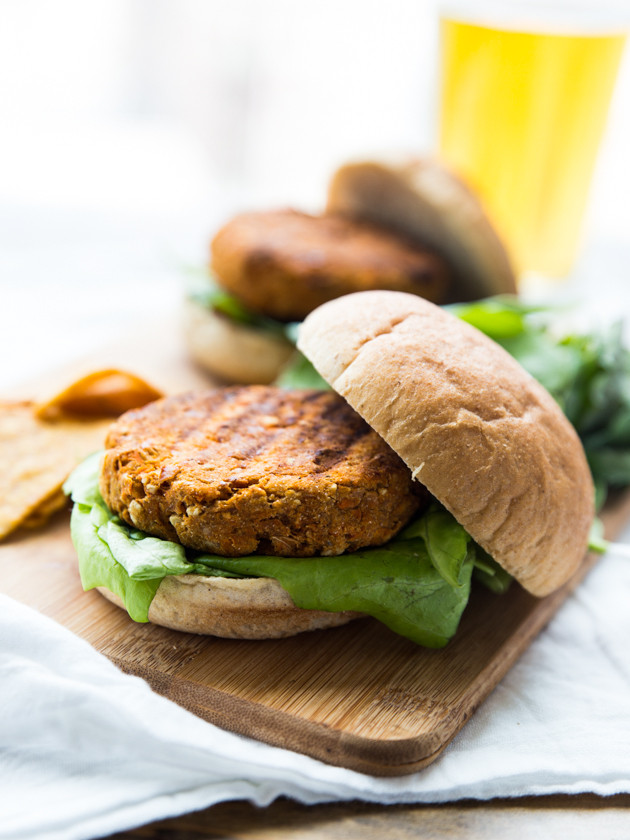 Buffalo Chickpea Sweet Potato Burgers with Whipped Feta Garlic Sauce // @veggiebeastblog