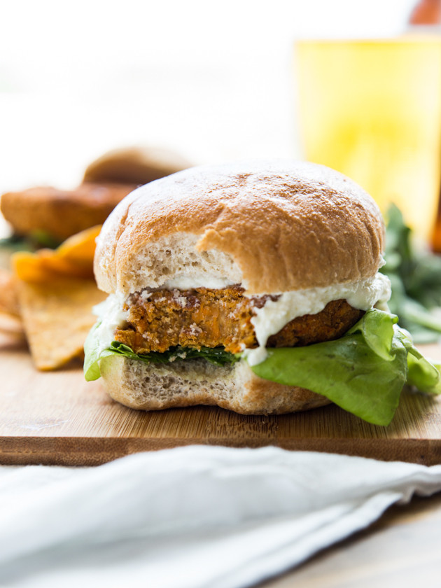 Buffalo Chickpea Sweet Potato Burgers with Whipped Feta Garlic Sauce // @veggiebeastblog
