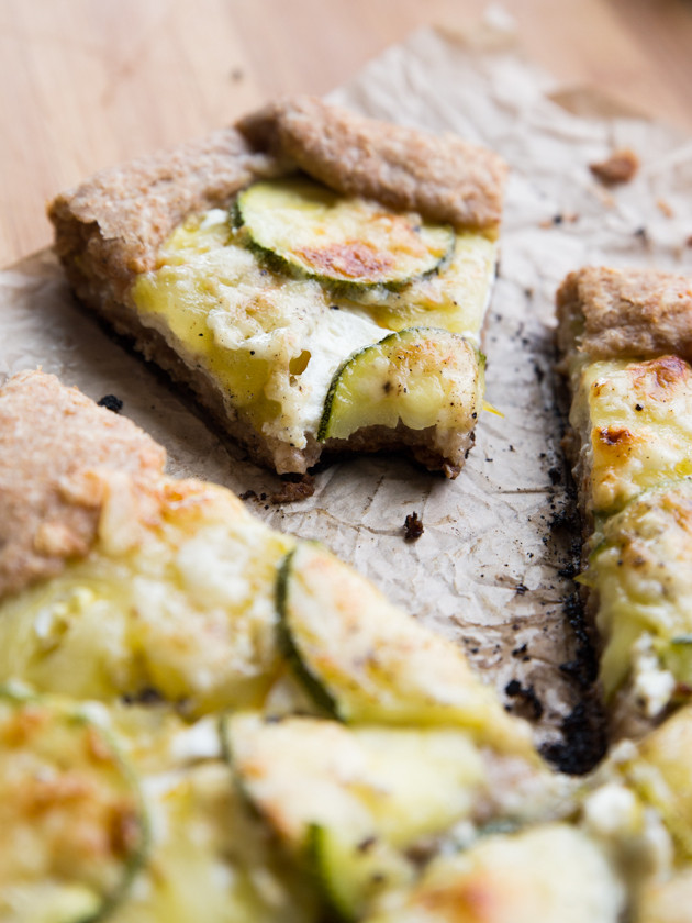 Zucchini and Heirloom Tomato Galette with Garlic Yogurt Sauce - summer veggies on top of creamy yogurt sauce, wrapped in a buttery whole wheat crust!