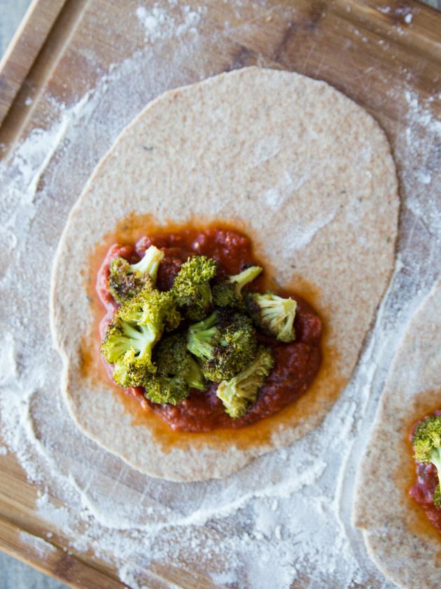 Roasted Broccoli and Smoked Gouda Calzones - homemade whole wheat beer crust, my favorite pizza sauce, and melty cheese! Comfort food at its finest.