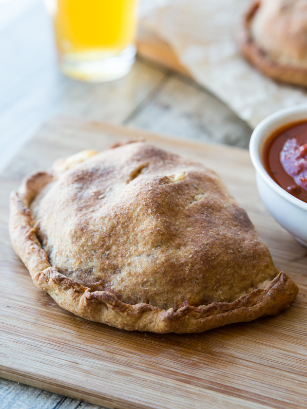 Roasted Broccoli and Smoked Gouda Calzones - homemade whole wheat beer crust, my favorite pizza sauce, and melty cheese! Comfort food at its finest.