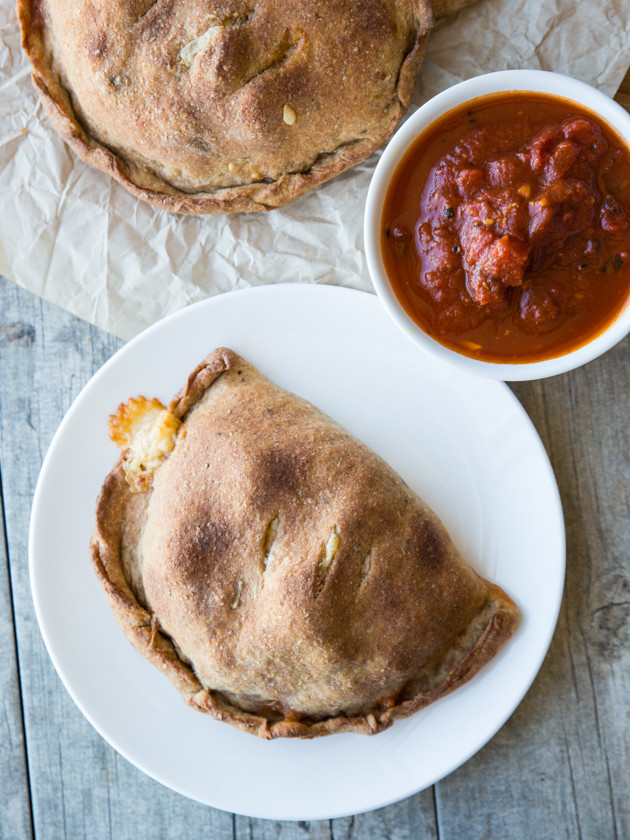 Roasted Broccoli and Smoked Gouda Calzones - homemade whole wheat beer crust, my favorite pizza sauce, and melty cheese! Comfort food at its finest.