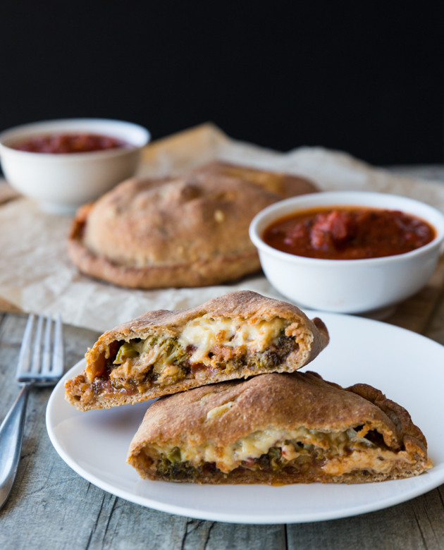 Roasted Broccoli and Smoked Gouda Calzones - homemade whole wheat beer crust, my favorite pizza sauce, and melty cheese! Comfort food at its finest.