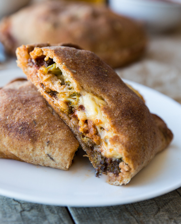 Roasted Broccoli and Smoked Gouda Calzones - homemade whole wheat beer crust, my favorite pizza sauce, and melty cheese! Comfort food at its finest.