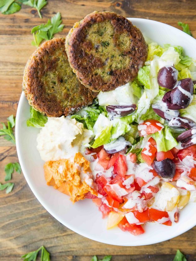 Easy vegan and gluten free falafel patties that are lightly pan-friend to golden brown, and drizzled with a quick tahini dill dressing.